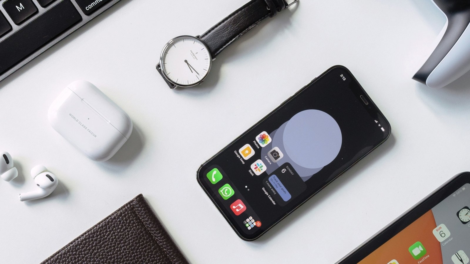 black iphone 7 beside black and silver key